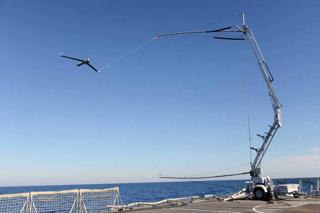 ScanEagle being caught by the Sky hook following its mission